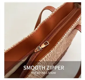 Detailed close-up of high-quality gold metal zipper and woven texture on a tote bag