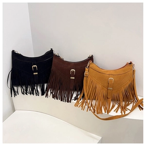 Three suede tassel crossbody bags in black, dark brown, and ginger yellow colors