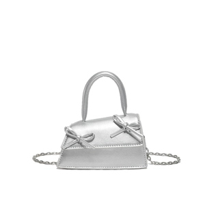 Chic silver mini trapezoid handbag with dual bow accents and metallic chain strap