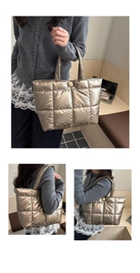 Detail view of champagne gold quilted puffer tote bag with glossy metallic finish