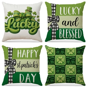 Set of four St. Patrick's Day pillow covers with green shamrock and Lucky prints