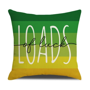 Green and yellow gradient square pillow cover with Loads of Luck text on linen fabric