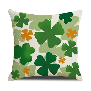 Saint Patrick's Day cushion cover with green and orange shamrock prints on linen texture