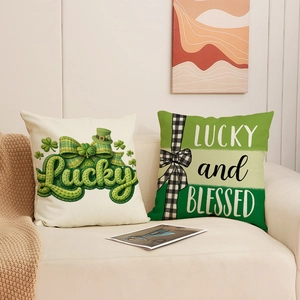 Pair of St. Patrick's Day cushion covers with Lucky and Blessed prints on a sofa