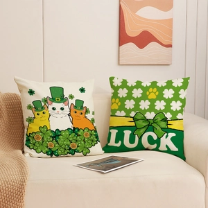 St. Patrick's Day cushion covers with clover cats and Luck text on a white sofa