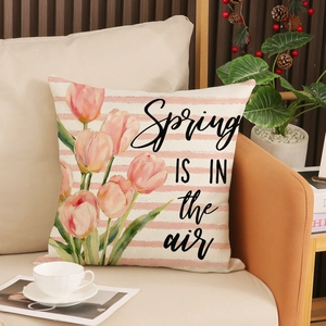 Linen tulip print cushion cover with Spring text on sofa in cozy home decor setting