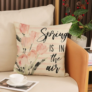 Pink tulip floral throw pillow with Spring is in the air text for sofa decor