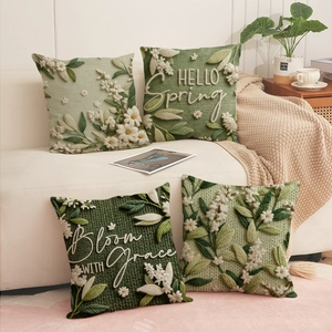 Set of four linen-textured pillow covers with floral embroidery and Hello Spring text