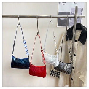 Trendy crocodile pattern shoulder bags in blue, red, white, and grey with acrylic chains