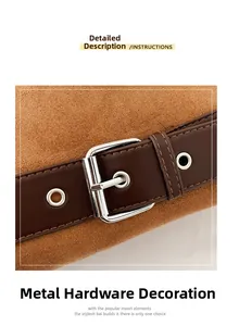 Close-up of vintage hardware with silver buckle and eyelets on brown suede handbag