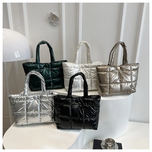 Quilted tote bags in five metallic colors featuring classic square stitching details