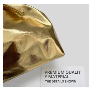 Detailed close-up of metallic gold cloud bag showing luxury pleated texture and glossy finish