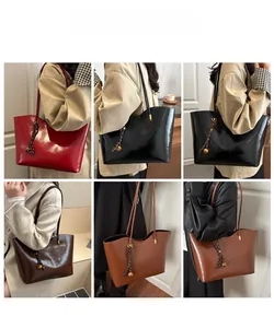 Detailed views of high-capacity tote bag in various colors with decorative woven knot charm