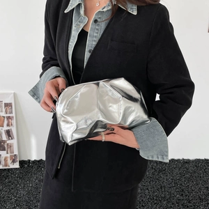 Metallic silver ruched cloud bag with reflective mirror finish and pleated texture