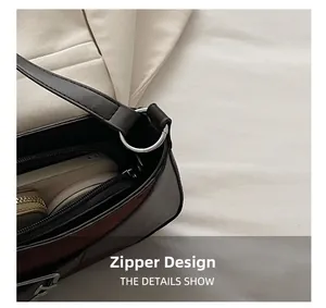 Detailed macro view showing the smooth zipper closure and silver metal strap connector