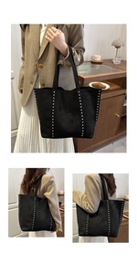 Détail du sac cabas en daim noir avec clous argentés et intérieur spacieux pour femme