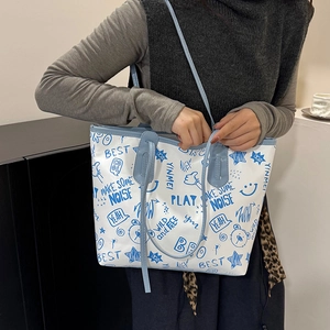 Graffiti tote bag with blue cartoon prints and stars for winter 2025 trendy street style