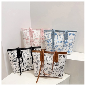 Group shot of colorful graffiti canvas tote bags with bear and star patterns