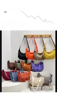 Detailed display of colorful nylon dumpling bags with adjustable straps in multiple vibrant hues