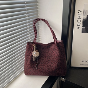 Leopard print tote bag in burgundy with woven handles and ice cream charm pendant