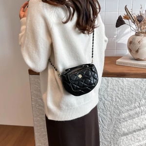 Quilted black crossbody bag with camellia flower logo and gold chain strap for women