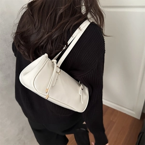 Minimalist cream white leather underarm bag with metal buckle and dual shoulder straps