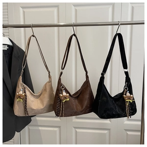 Detailed comparison of hobo bags in beige, brown, and black with cute bear charms