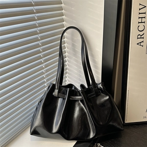 Chic black oil wax leather tote bag with pleated design and slim double straps for women