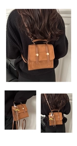 Brown faux suede mini backpack with bear patterns and a cute knitted bear keychain detail