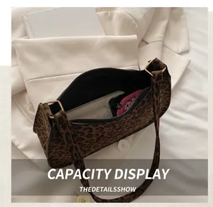 Detailed interior view showing large capacity of the leopard print shoulder bag