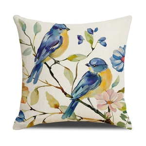 Linen cushion cover with artistic bird and floral print on a natural beige background