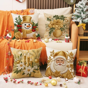 Lot de quatre housses de coussin de Noël en lin avec motifs brodés de Père Noël