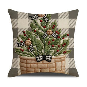Christmas pillow cover featuring embroidered potted plant with red berries and bowknot