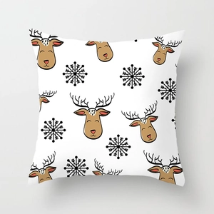 Detailed pattern of brown reindeer and black snowflakes on white Christmas pillowcase