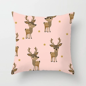 Detail view of a pink pillowcase with cartoon deer and stars on soft fabric texture