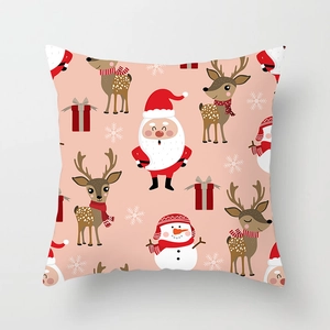 Detail of pink Christmas pillowcase featuring cartoon Santa, reindeer, and snowman pattern