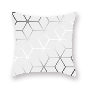 Detail of silver geometric honeycomb pattern on soft white peach skin pillowcase