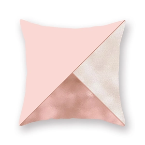 Detail of rose gold foil and pink geometric triangles on soft decorative pillowcase