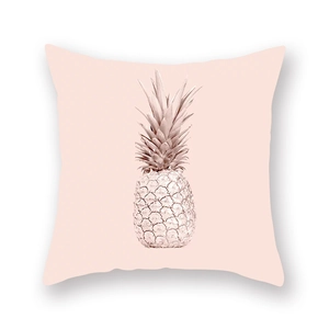 Detail shot of square peach skin pillowcase with a golden pineapple pattern on pink