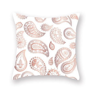 Detail of rose gold paisley pattern on white square throw pillow cover with metallic finish