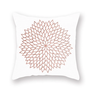 Detailed close-up of rose gold mandala floral geometric pattern on white pillowcase