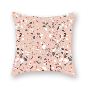Detail of rose gold peach skin pillowcase with trendy terrazzo stone pattern and texture