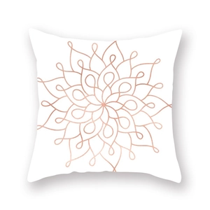 Close-up of mandala pattern cushion cover in rose gold and white peach skin fabric