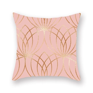Close-up of pink peach skin pillowcase with golden geometric lines in minimalist style