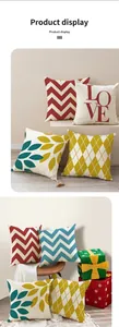 Close-up of geometric linen pillow covers with red waves and yellow diamond patterns