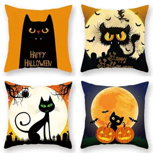 Set of four Halloween pillow covers with pumpkin lanterns and black cat designs