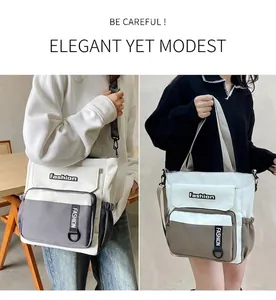 Detail of trendy large canvas crossbody bag with multi-pocket and two-tone design