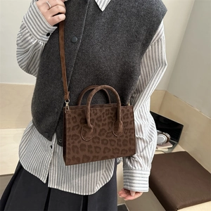 Stylish brown leopard print square handbag with top handles and adjustable shoulder strap
