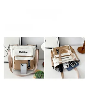 Detailed interior of a contrast canvas tote showing compartments for tablets and daily items