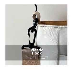 Macro detail of high-density plastic hook and durable strap on canvas school bag